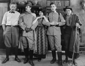 Photograph taken on the set of Thy Name is Woman (1924). Pictured with Barbara are (left to right) director Fred Niblo and co-stars Wallace MacDonald, Ramon Novarro, and William V. Mong.